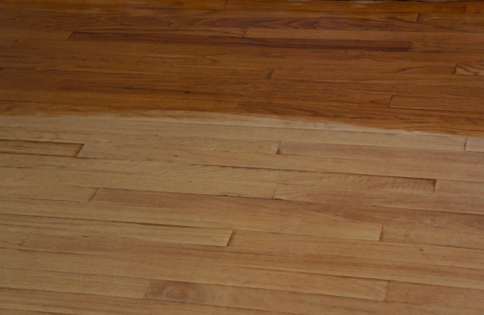 Sanded Hardwood Floor with Polyurethane on Half of it.